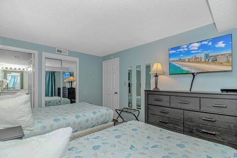 Cozy beds, 43” Roku TV, and private bathroom access.