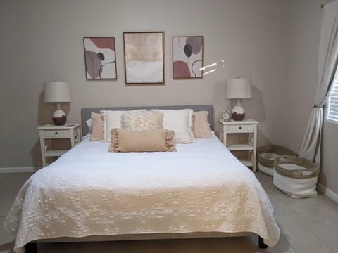 Comfy king bed in the downstairs main bedroom