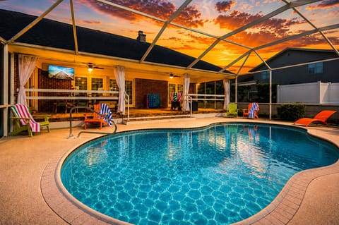Watch the sky turn pink and orange from the screened pool as the day winds down.