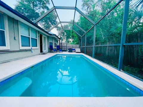 Enjoy your own private screened pool — perfect for morning swims or evening relaxation under the palms.