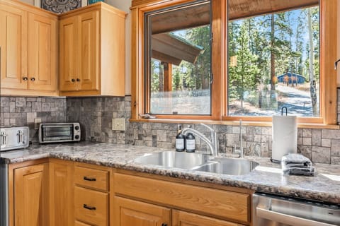 Kitchen: Main floor, drip coffee maker, Crockpot, blender, toaster, cooking utensils, tableware