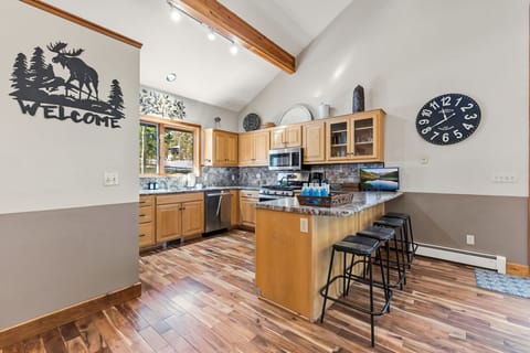 Kitchen: Main floor, drip coffee maker, Crockpot, blender, toaster, cooking utensils, tableware