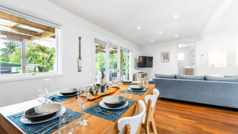 Dining area with leafy garden views.