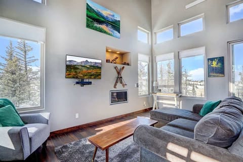 Living Room: Bright and airy retreat with stunning views and a stylish fireplace!