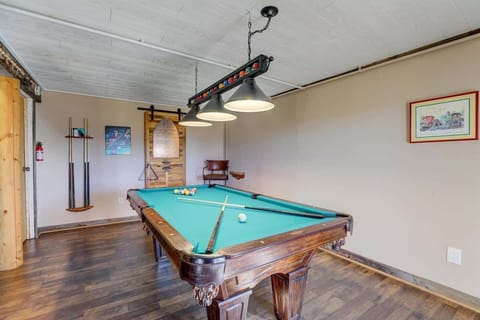 Game Room: Unwind and challenge friends in this stunning pool haven with scenic views!


