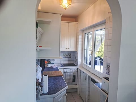 Interior Design, Flooring, Kitchen, Major Appliance, Floor, Countertop, Ceiling, Furniture, Cabinetry, Lighting