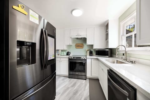 Fully equipped with stainless steel appliances and sleek finishes.