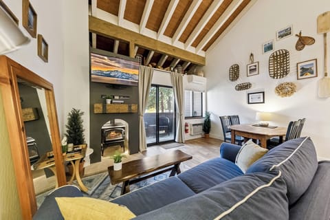 Cozy up in your living room with exposed beams, crackling fireplace, and rustic charm that makes every evening feel magical.