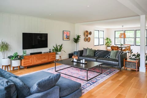 Enter into the living room with two massive and comfortable couches