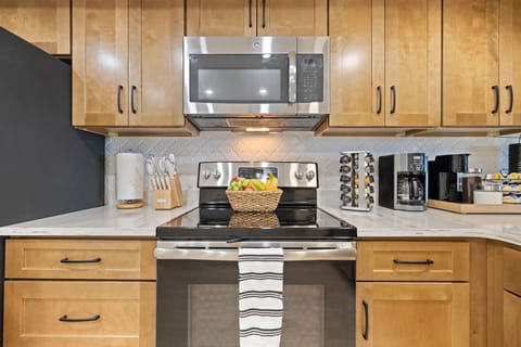 New completely renovated full stocked kitchen with quartz counter tops.