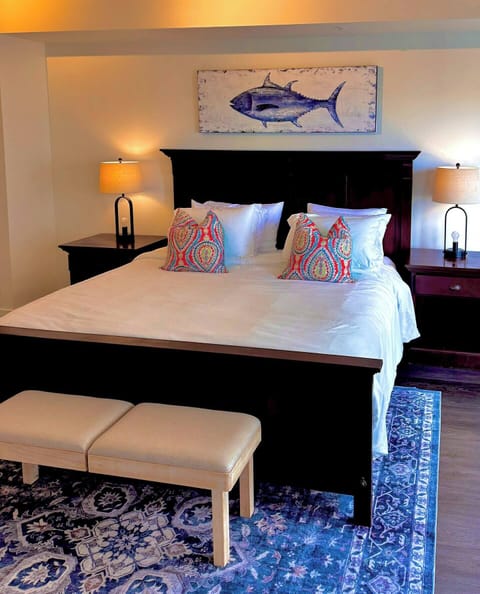 Unwind on the plush king-size bed with a brand-new Posturepedic mattress, soft new pillows, and fresh luxury linens for a restful night’s sleep.