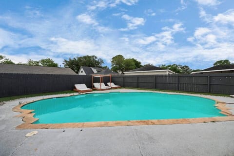 Daybeds and loungers lined up for sunny lounging.