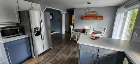 Dining area with patio to balcony with porch swing