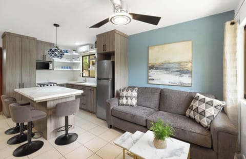Incredible open living with a full size, comfortable sofa and island seating