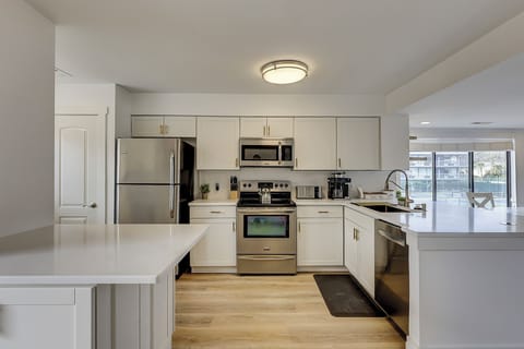 Fully stocked kitchen with stainless steel appliances. Also included is a wireless charging port.