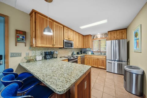 Spacious Kitchen with Granite Counters and Stainless Appliances