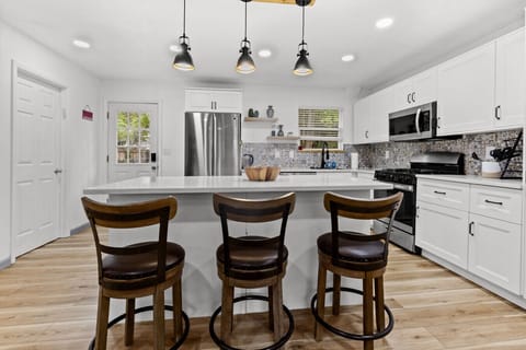 Enjoy casual meals or morning coffee at the breakfast bar with seating for four.