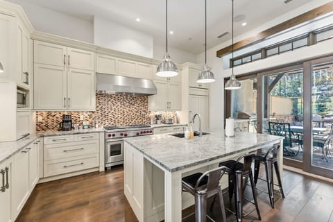 Kitchen: Main floor, Sub-Zero fridge, Wolf range, Keurig and drip coffee maker, Crockpot, toaster, cooking utensils, tableware