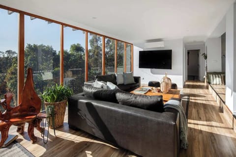 TV big enough to satisfy the screen-lovers. Forest views bold enough to convince them to look up.