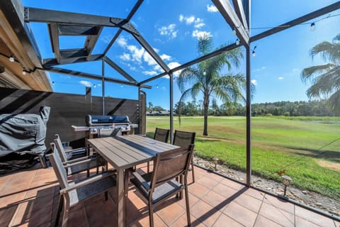 Gather around the outdoor table for a meal fresh off the grill — seating for six with tranquil pond and golf course views