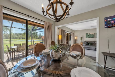 Bright dining area connected to the kitchen, offering scenic views and plenty of natural light
