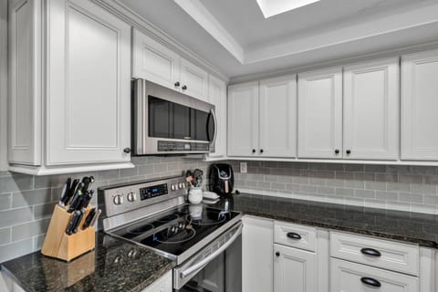 Fully equipped kitchen with stovetop, oven, and microwave — everything you need to prepare your favorite meals.