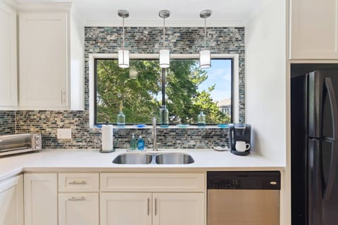 Enjoy gorgeous views out of the window overlooking the kitchen sink.