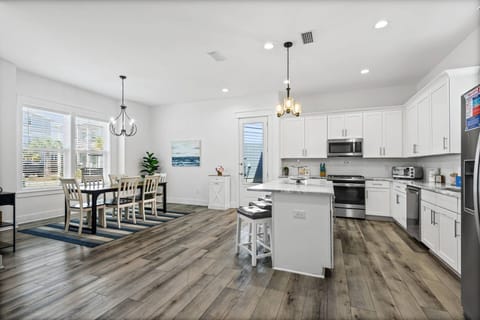 The well appointed kitchen is open to the dining and living areas and opens out to a covered back patio