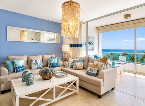 Oceanview living room with A/C, smart TV, and direct access to private balcony.