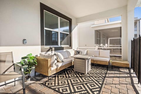 Relax on the stylish patio with comfortable seating and enjoy the serene outdoor ambiance.