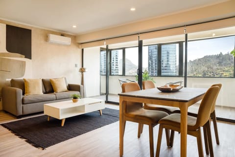 Enjoy a bright, modern living and dining space featuring large windows. It's the ideal spot to start your day or simply unwind while taking in the spectacular views.