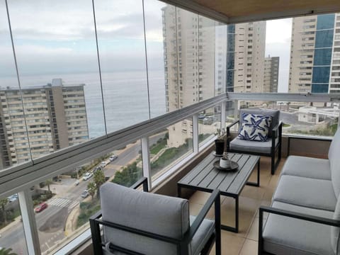 Relax on the private balcony with breathtaking ocean views, perfect for unwinding with a morning coffee or evening drink.