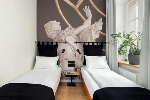 Relax in a beautifully designed room with art-inspired décor and a refreshing touch of greenery.