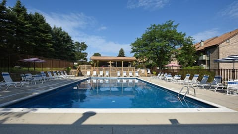 Inviting outdoor pool surrounded by sunshine and fresh mountain air, ideal for relaxing summer days.