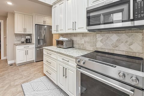 Bright, clean, and functional kitchen with everything you need for lakefront living.