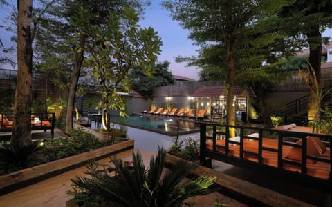 Outdoor pool, open 9:00 AM to 9:00 PM, free cabanas, pool umbrellas