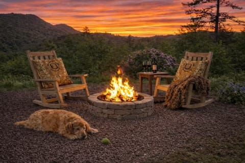 Evenings here tend to linger — sunset views by the firepit, steps from dog yard