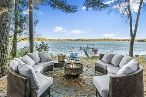 Outdoor Lounge | Comfortable Seating, Shaded Trees & Lake Views