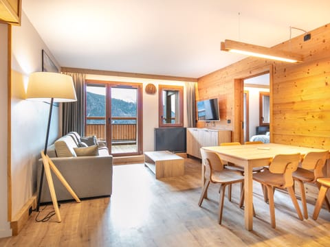 Unwind in a bright living area with a comfortable sofa and ample natural light.