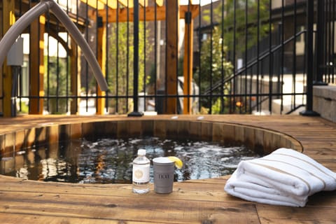 Spa-style hot tub with plush towels for a luxury stay experience