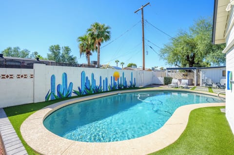 Bask in the Arizona sunshine by your private pool, complete with a colorful cactus mural and cozy lounge seating—perfect for relaxing mornings, afternoon swims, or golden hour cocktails in your own desert oasis.
