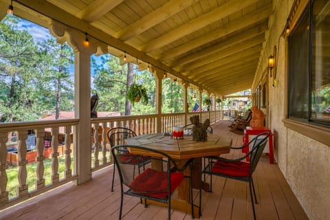 Covered Deck | Outdoor Dining Table, Rocking Chairs & String Lights