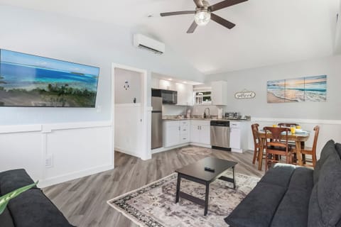Bright open-concept with 55" TV—modern space ready to welcome and relax.