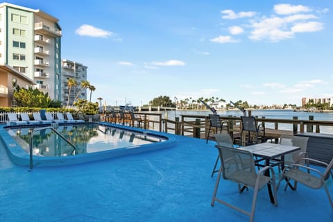 Poolside chairs & dockside views—perfect from sunrise to sunset