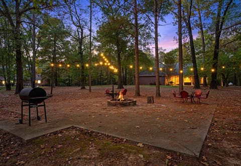 Outdoor seating and firepit area perfect for evenings under the lights.