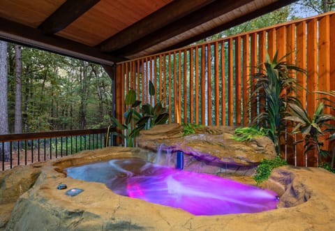 Relax in the private hot tub tucked beneath a cozy covered deck.