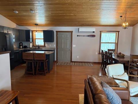 Upstairs main living space with front entry door.