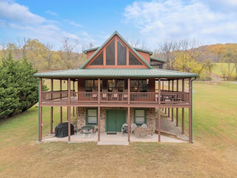 Charming two-story cabin with wraparound porch & scenic views—perfect for peaceful getaways.