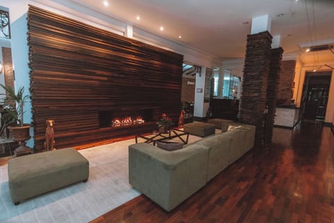 Unwind by the glowing fireplace in a stylish lounge.
