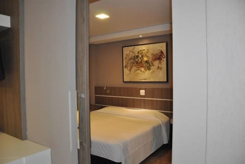 Wake up to a peaceful bedroom view with warm ambient lighting.